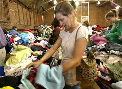 College girls looking for good deals shopping for clothes.